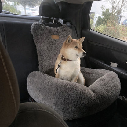 A Shiba Inu in a grey Nordpaw lounger car bed, photographed from the front seat over the headrest