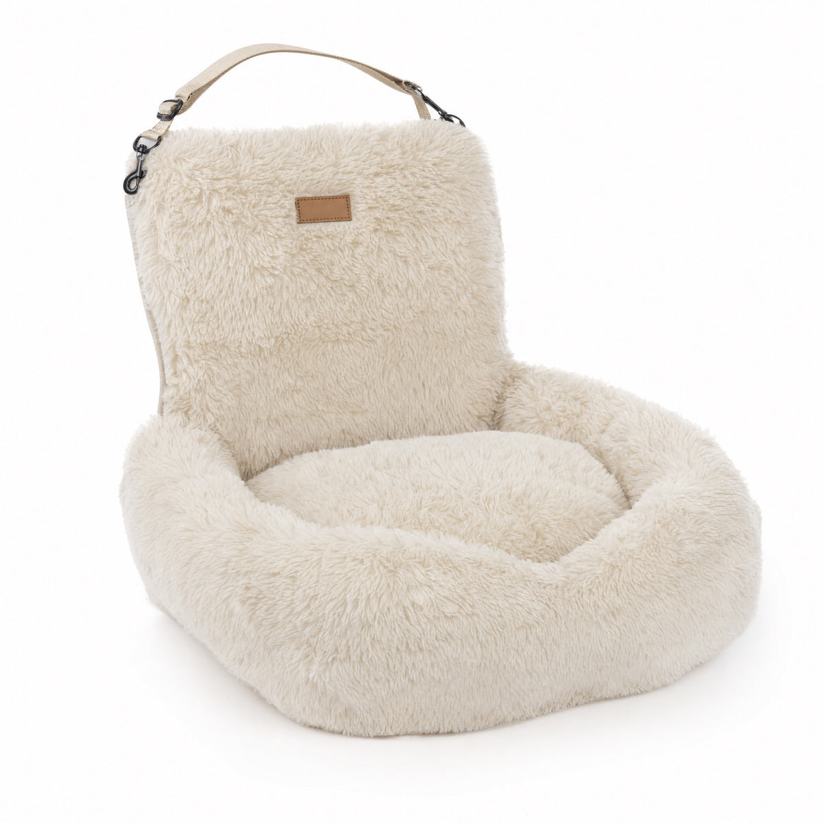 Nordpaw lounger car bed in cream, shown alone on a white background with its tall backrest and carry strap
